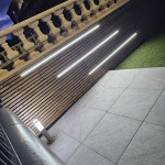 Outdoor panelled fence lighting