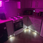 Kitchen kickboard lights and pink neon sign