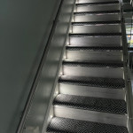 Wood and carpet stairs with spotlights