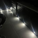 dark kitchen with kickboard spotlights
