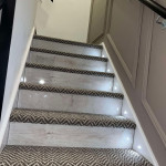 modern staircase with panelling and spotlights